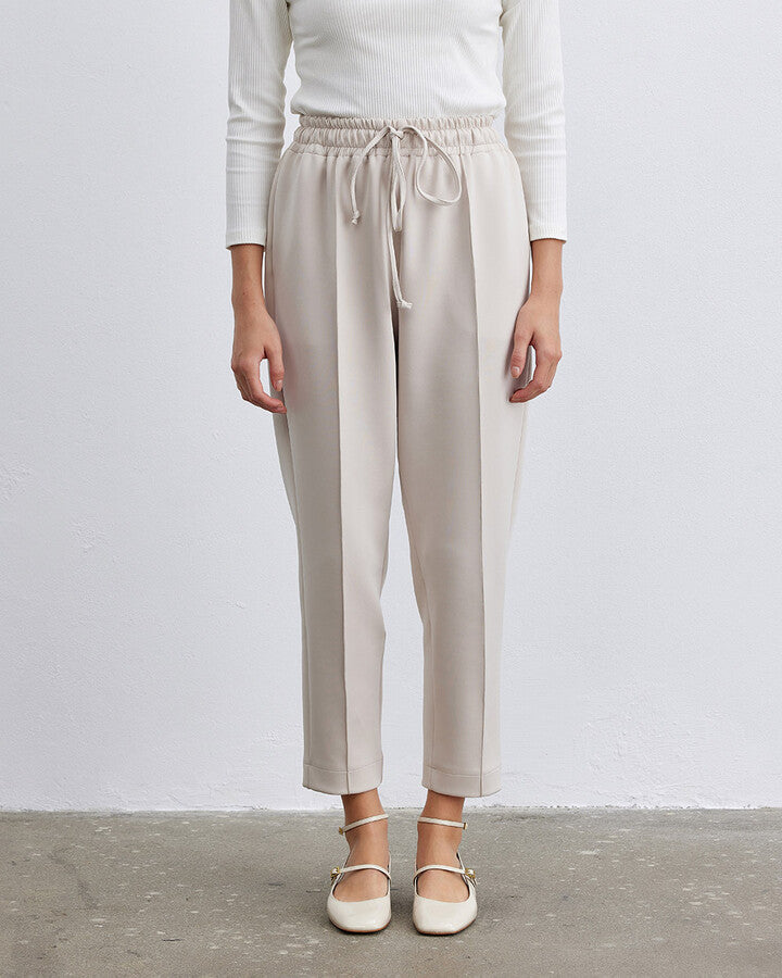 Beige Scuba Elastic Pocket Carrot Cut Trousers