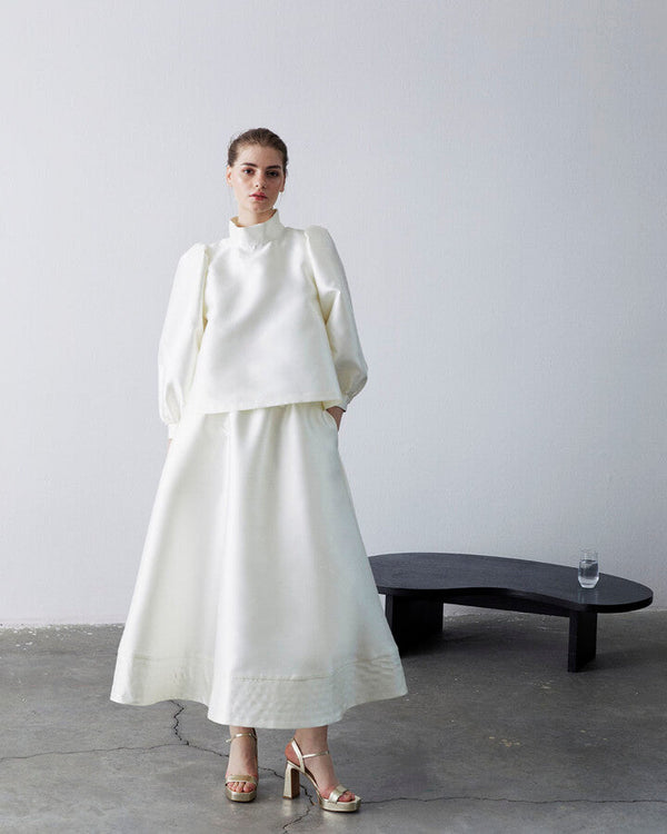 Ecru Swan Pleated Pocket Front Skirt with Ruffle Detail