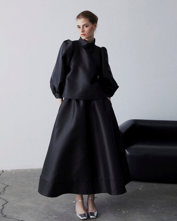 Black Swan Pleated Pocket Front Skirt with Ruffle Detail